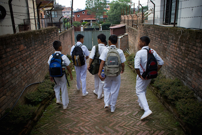 The boys head to school.