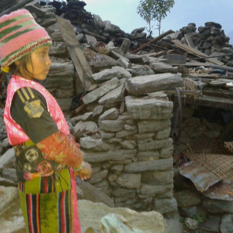 This young girl lost her sister in the quake.  Here she is showing Raju the remains of her house "where she used to play with her small sister who died that day..."